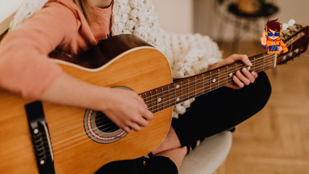 A person sitting on a chair, casually playing an acoustic guitar, wrapped in a cozy knit blanket. The warm indoor setting emphasizes relaxation and creativity, highlighting the joy and benefits of learning a new hobby.